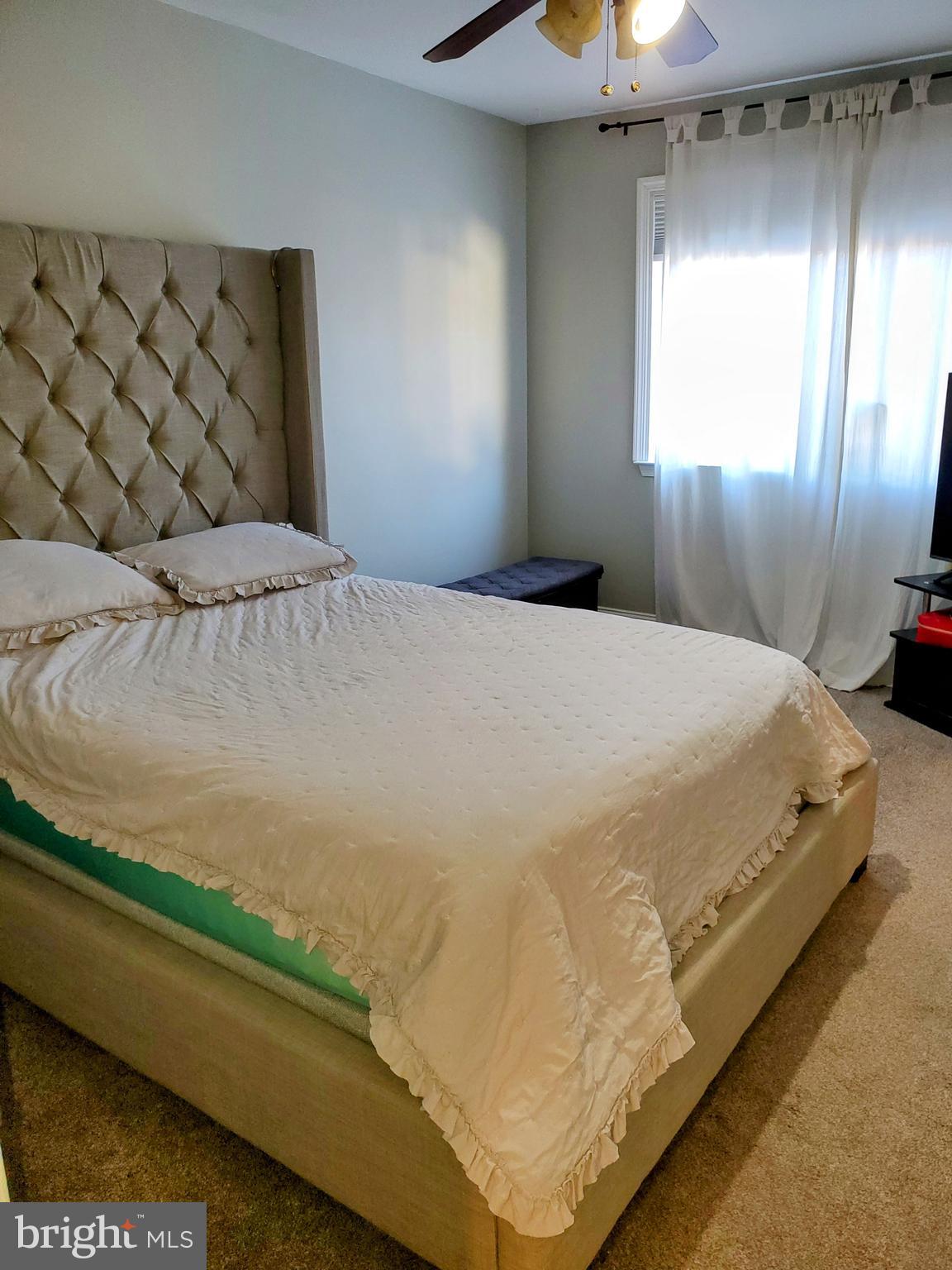 106 Five Crown Royal Marlton, NJ 08053 - Photo 17 of 27 a bed sitting in a spacious bedroom next to a window