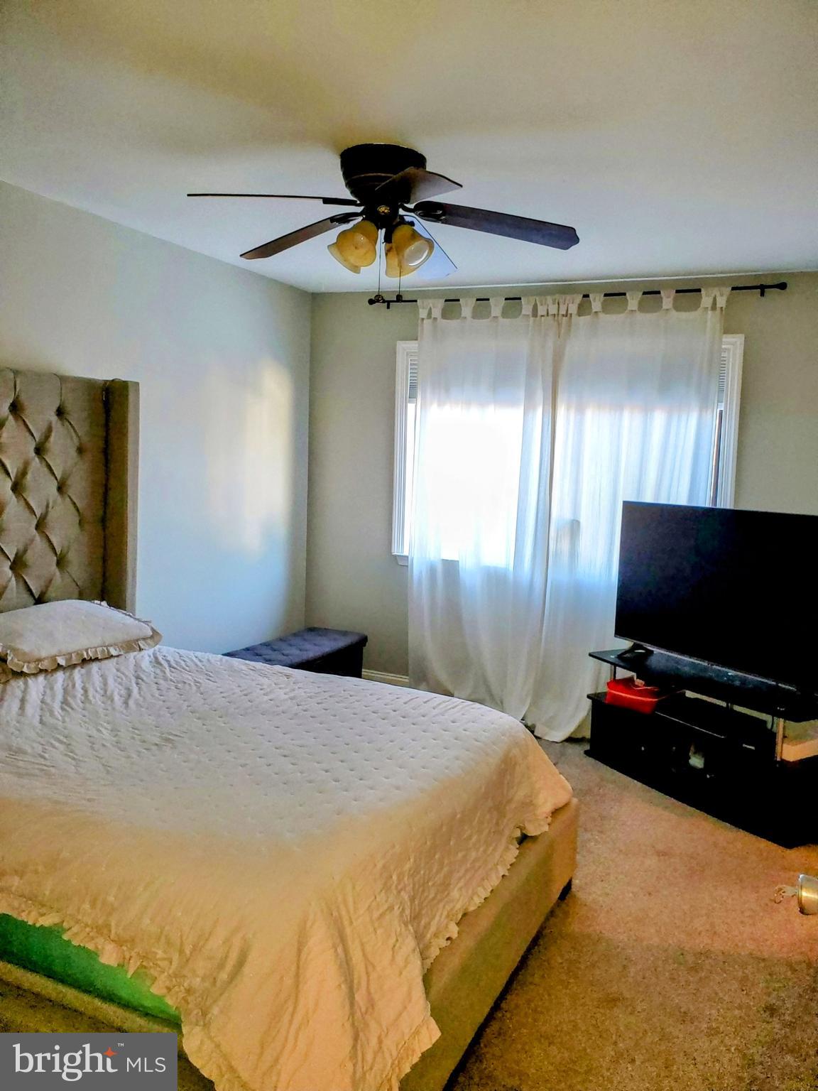 106 Five Crown Royal Marlton, NJ 08053 - Photo 19 of 27 a bedroom with a bed and a flat screen tv