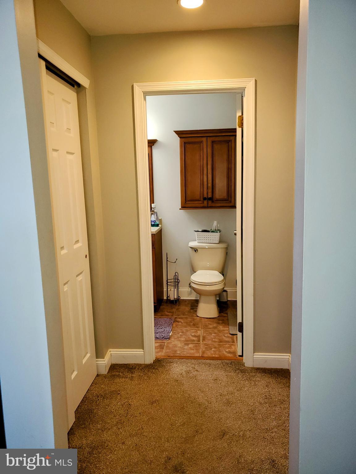 106 Five Crown Royal Marlton, NJ 08053 - Photo 21 of 27 a living room with a table and a chair