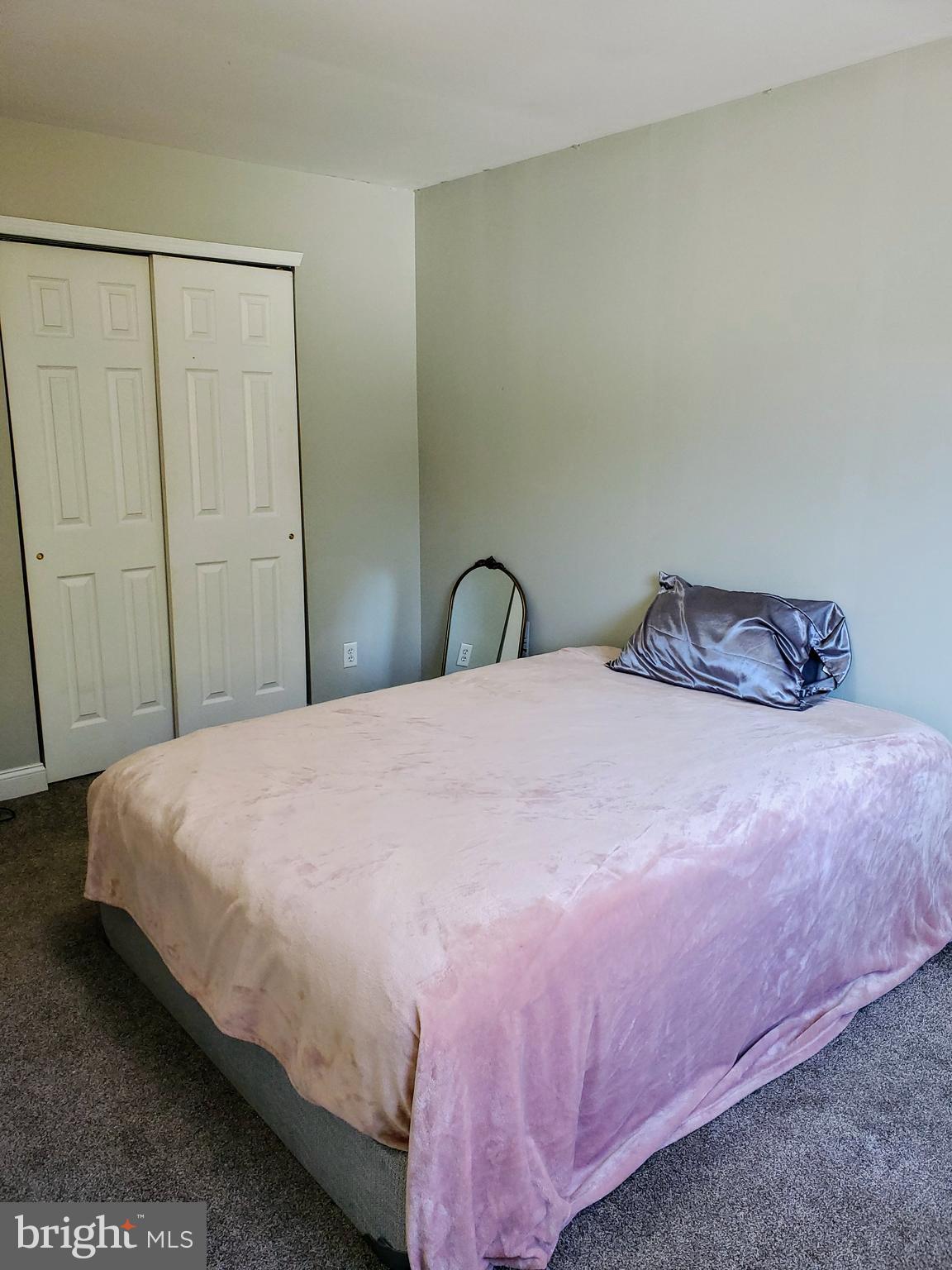 106 Five Crown Royal Marlton, NJ 08053 - Photo 22 of 27 a bedroom with a bed and a mirror