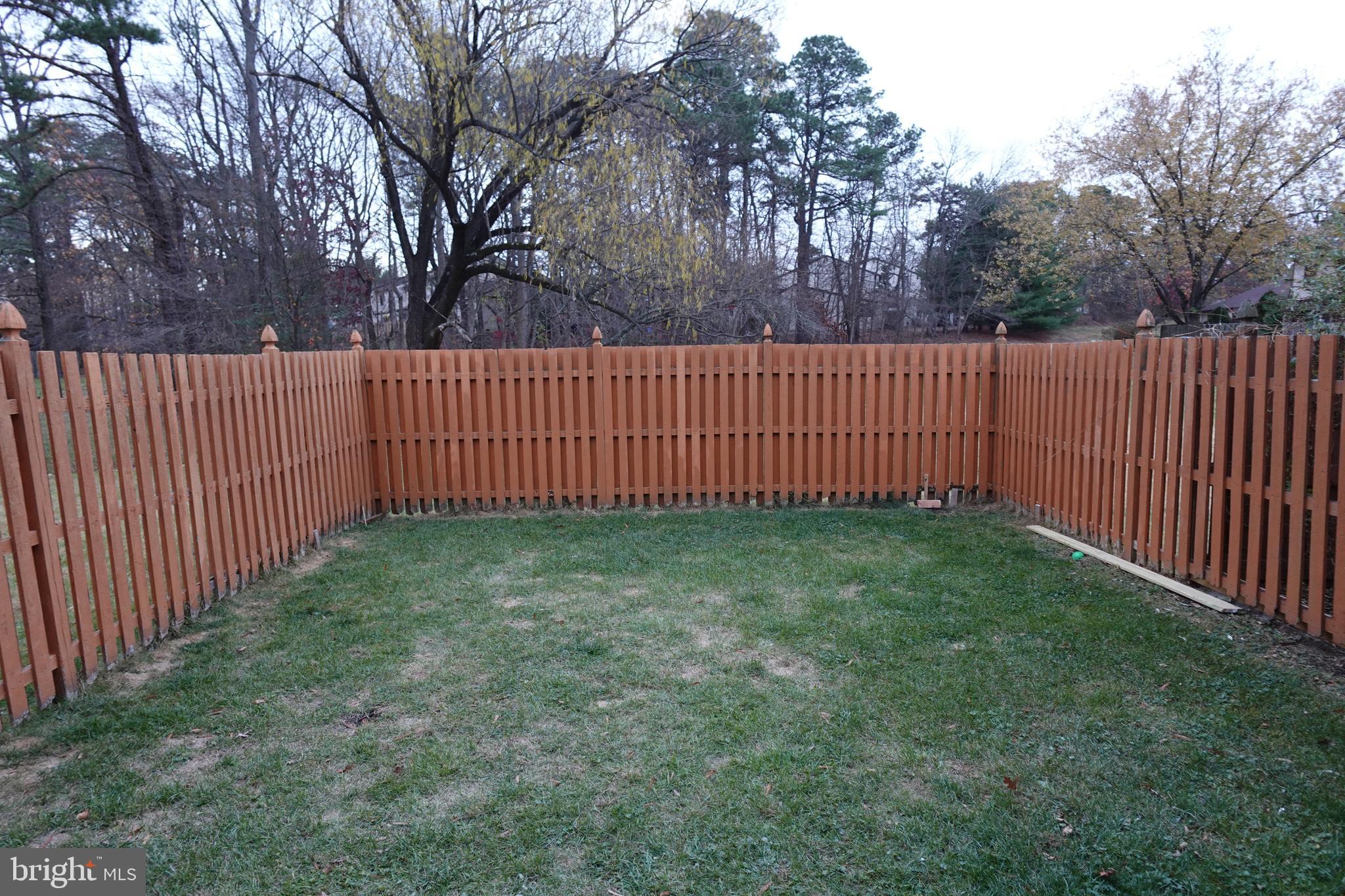 106 Five Crown Royal Marlton, NJ 08053 - Photo 27 of 27 a view of a yard with wooden fence