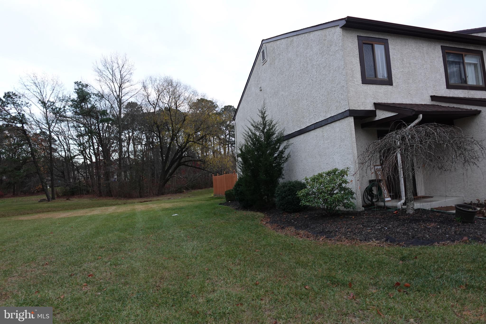 106 Five Crown Royal Marlton, NJ 08053 - Photo 4 of 27 a backyard of a house with lots of green space