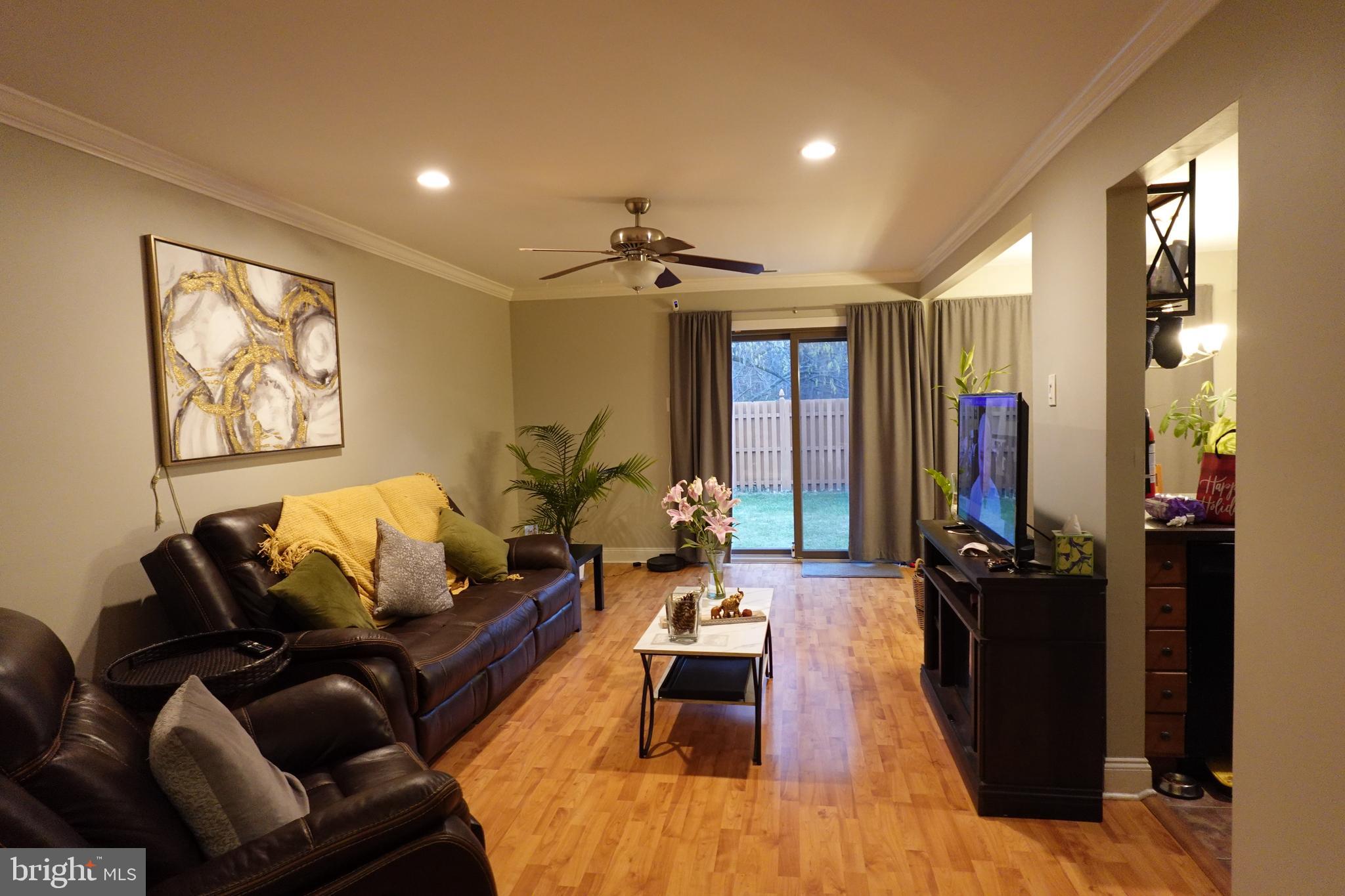 106 Five Crown Royal Marlton, NJ 08053 - Photo 5 of 27 a living room with furniture and wooden floor