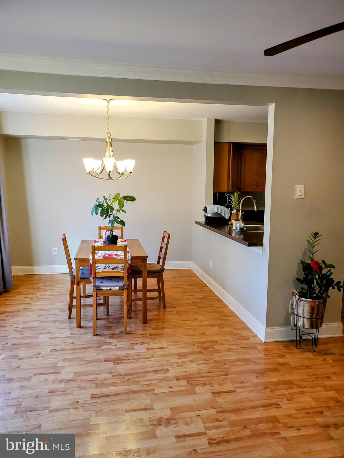 106 Five Crown Royal Marlton, NJ 08053 - Photo 9 of 27 a view of a dining room with furniture and wooden floor