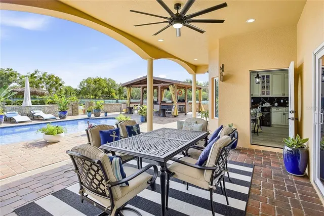 a view of a house with fountain bath tub and fire pit