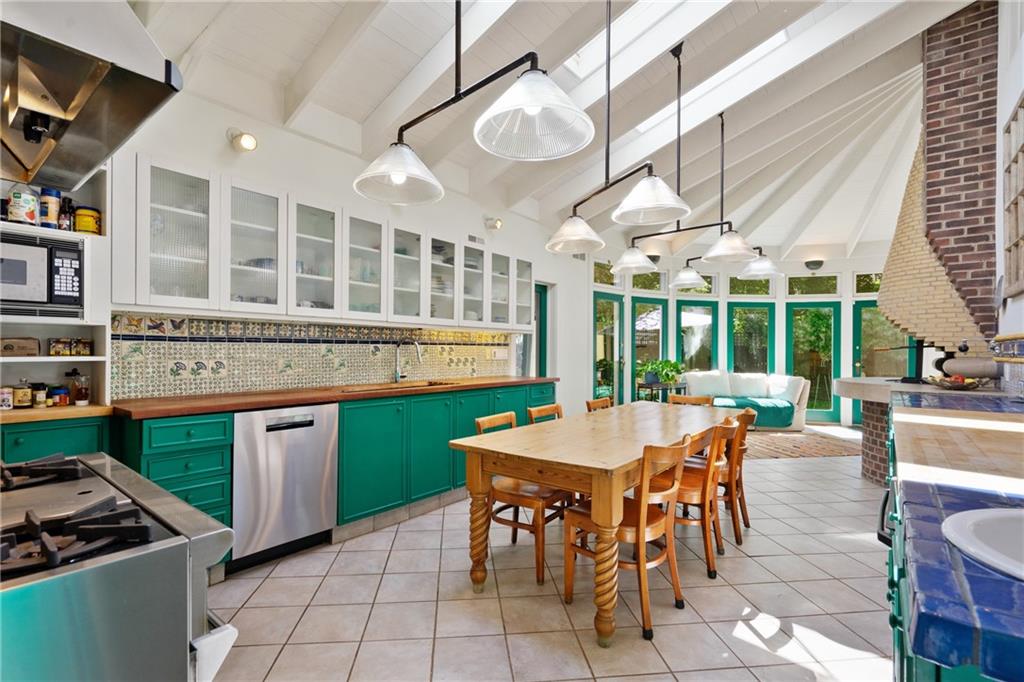 5306 Westminster Place Pittsburgh, PA 15232 - Photo 13 of 50 a kitchen with a table chairs and a stove