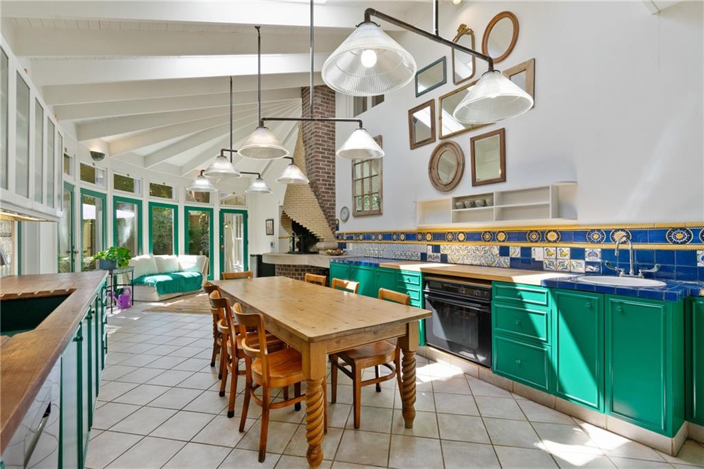 5306 Westminster Place Pittsburgh, PA 15232 - Photo 16 of 50 a kitchen with a table chairs and a chandelier