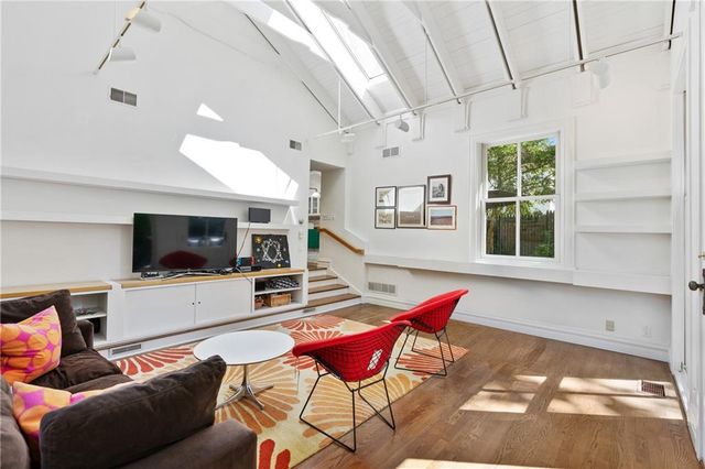 a view of a balcony with wooden floor and door