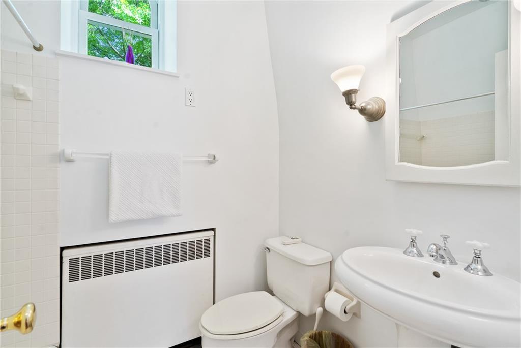 5306 Westminster Place Pittsburgh, PA 15232 - Photo 24 of 50 a white toilet sitting next to a bathroom sink