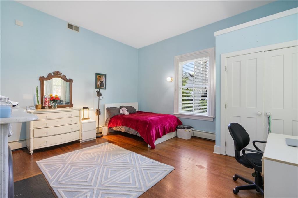 5306 Westminster Place Pittsburgh, PA 15232 - Photo 31 of 50 a bedroom with a bed and wooden floor