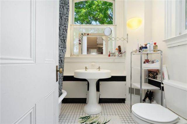 a bedroom with a bed and a table