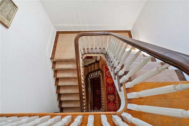 a bedroom with a bed and a fireplace