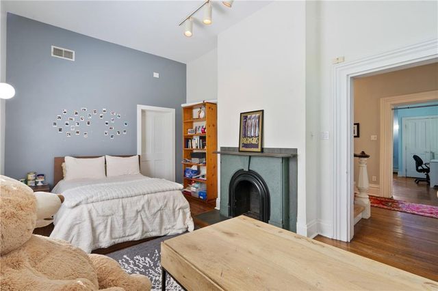 a view of livingroom with workspace and a fireplace