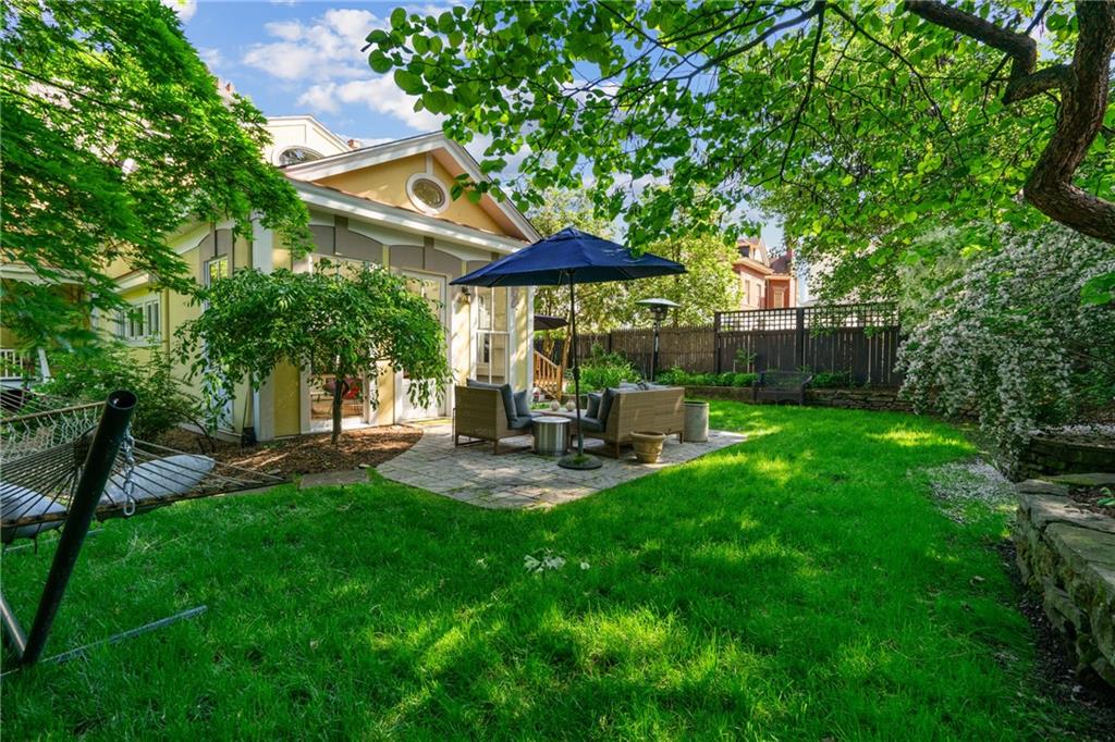 5306 Westminster Place Pittsburgh, PA 15232 - Photo 45 of 50 a view of a patio with table and chairs under an umbrella