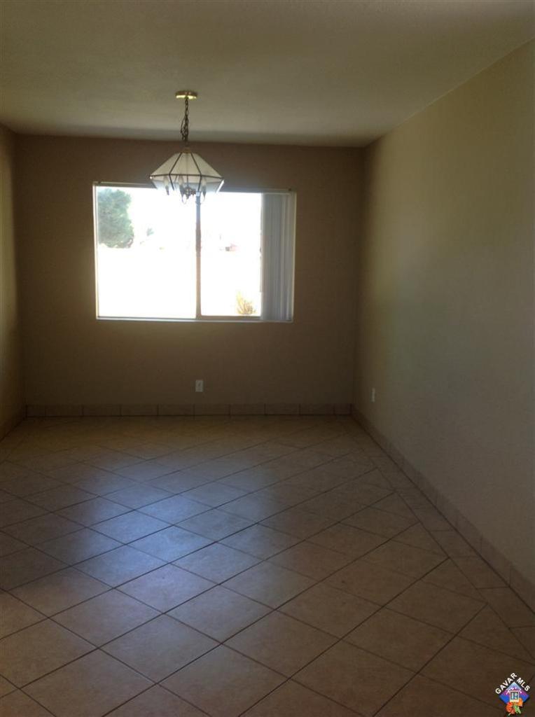 44015 Sorrell Lane Lancaster, CA 93535 - Photo 3 of 5 wooden floor in an empty room with a window