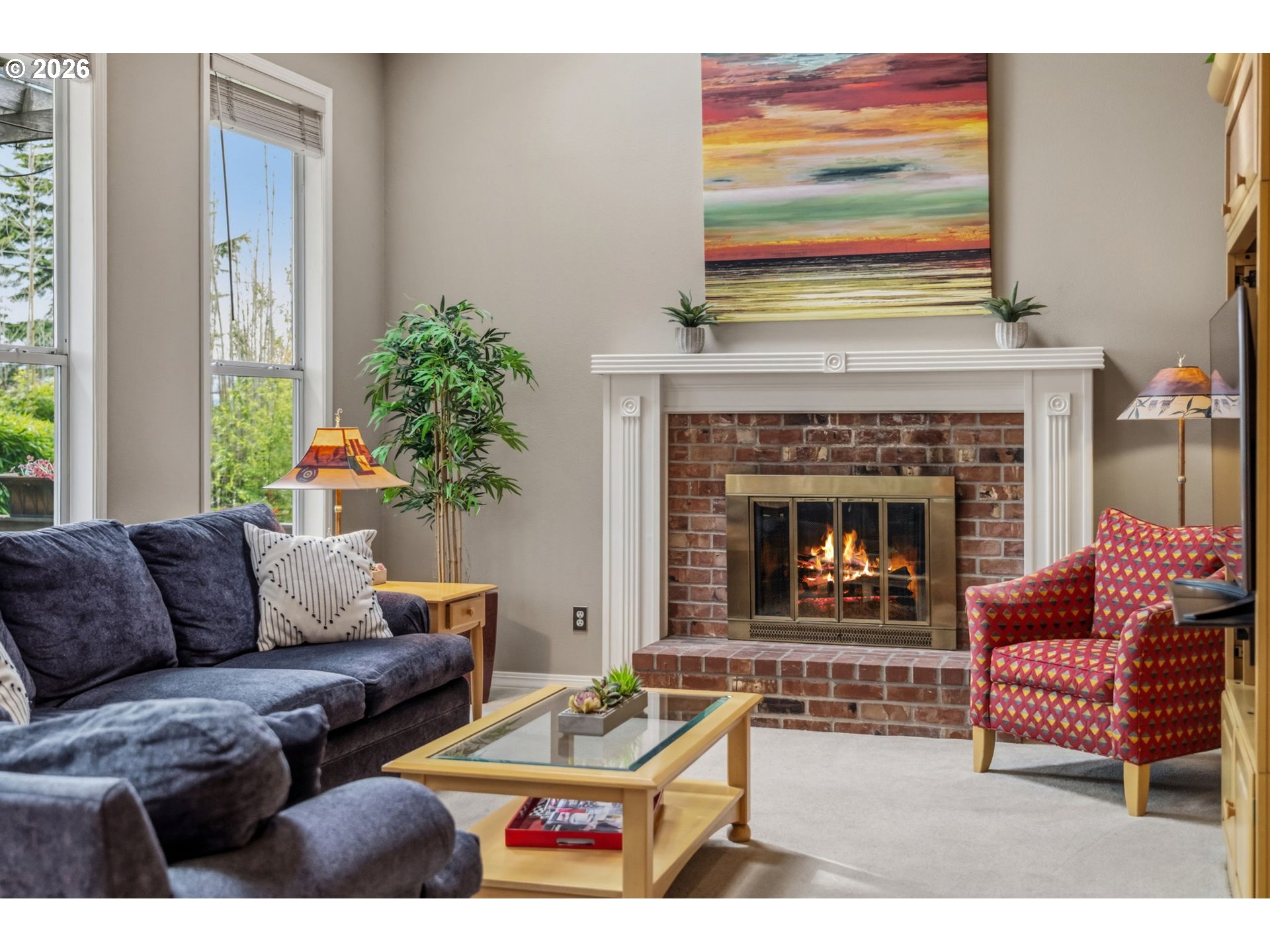 6108 Southwest Kruse Ridge Drive Portland, OR 97219 - Photo 15 of 42 a living room with furniture and a fireplace