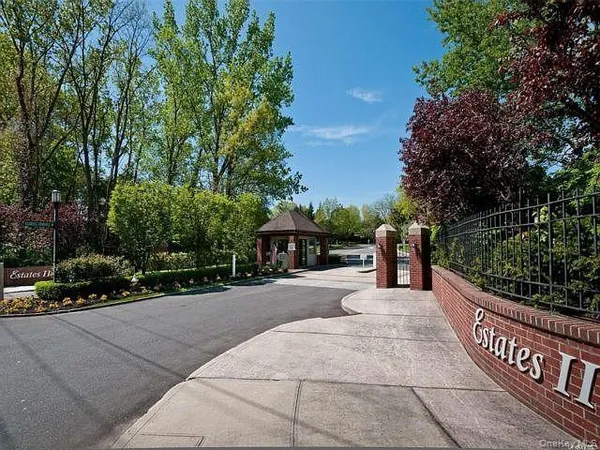 a kitchen with stainless steel appliances a refrigerator sink and white cabinets