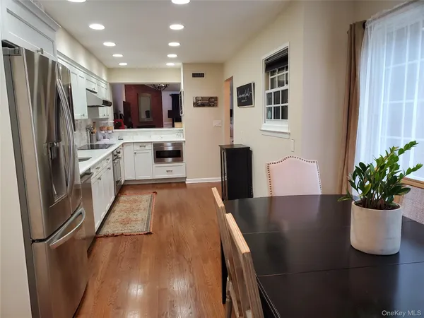 a kitchen with stainless steel appliances granite countertop a sink and cabinets