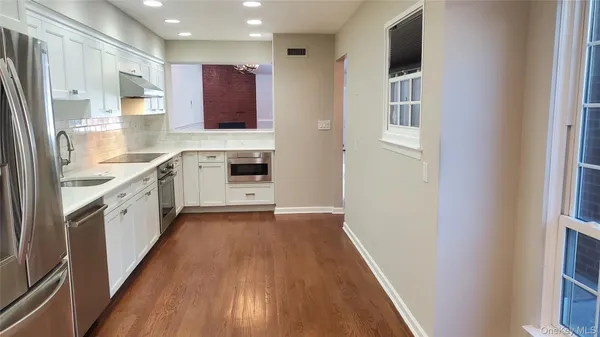 a view of a house with sitting area and swimming pool