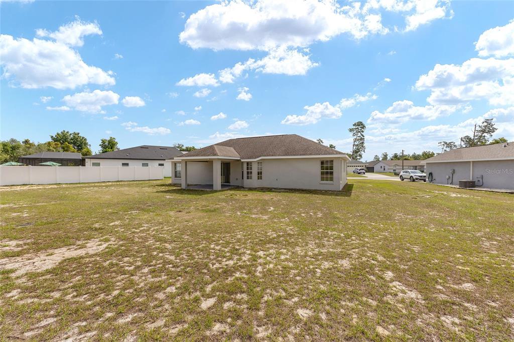 15434 Southwest 23rd Court Road Ocala, FL 34473 - Photo 41 of 41 a front view of a house with a ocean view