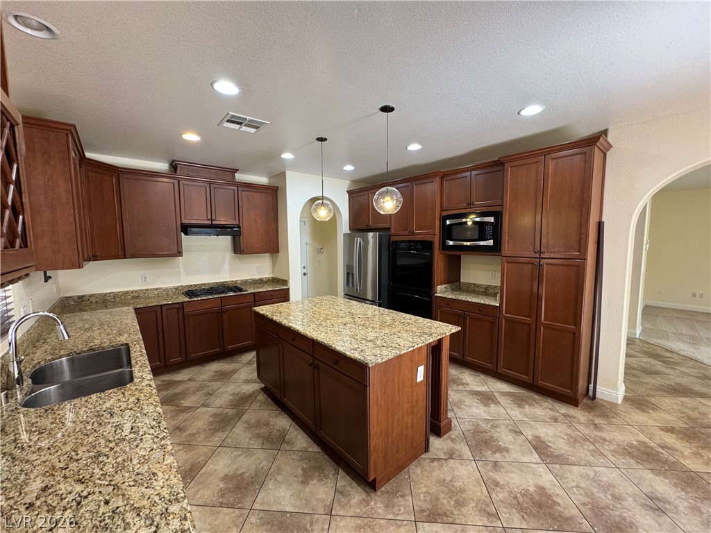 1333 Jamesbury Road Las Vegas, NV 89135 - Photo 17 of 43 Granite counters and stainless steel appliances complete this spacious, well-appointed kitchen.