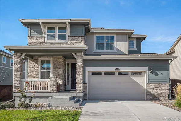 a front view of a house with garage