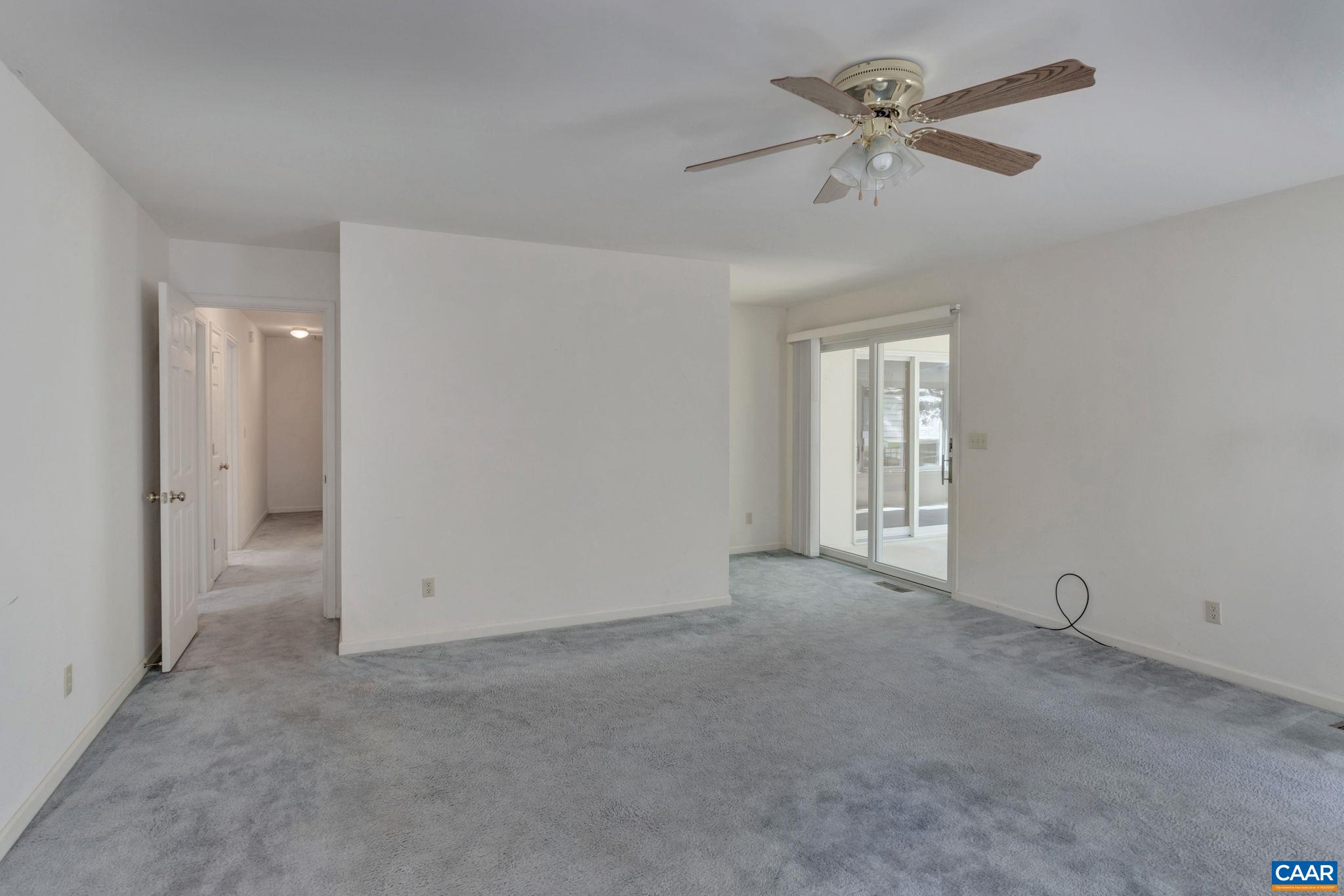 9795 Critzer Shop Road Afton, VA 22920 - Photo 17 of 22 a view of an empty room with a ceiling fan