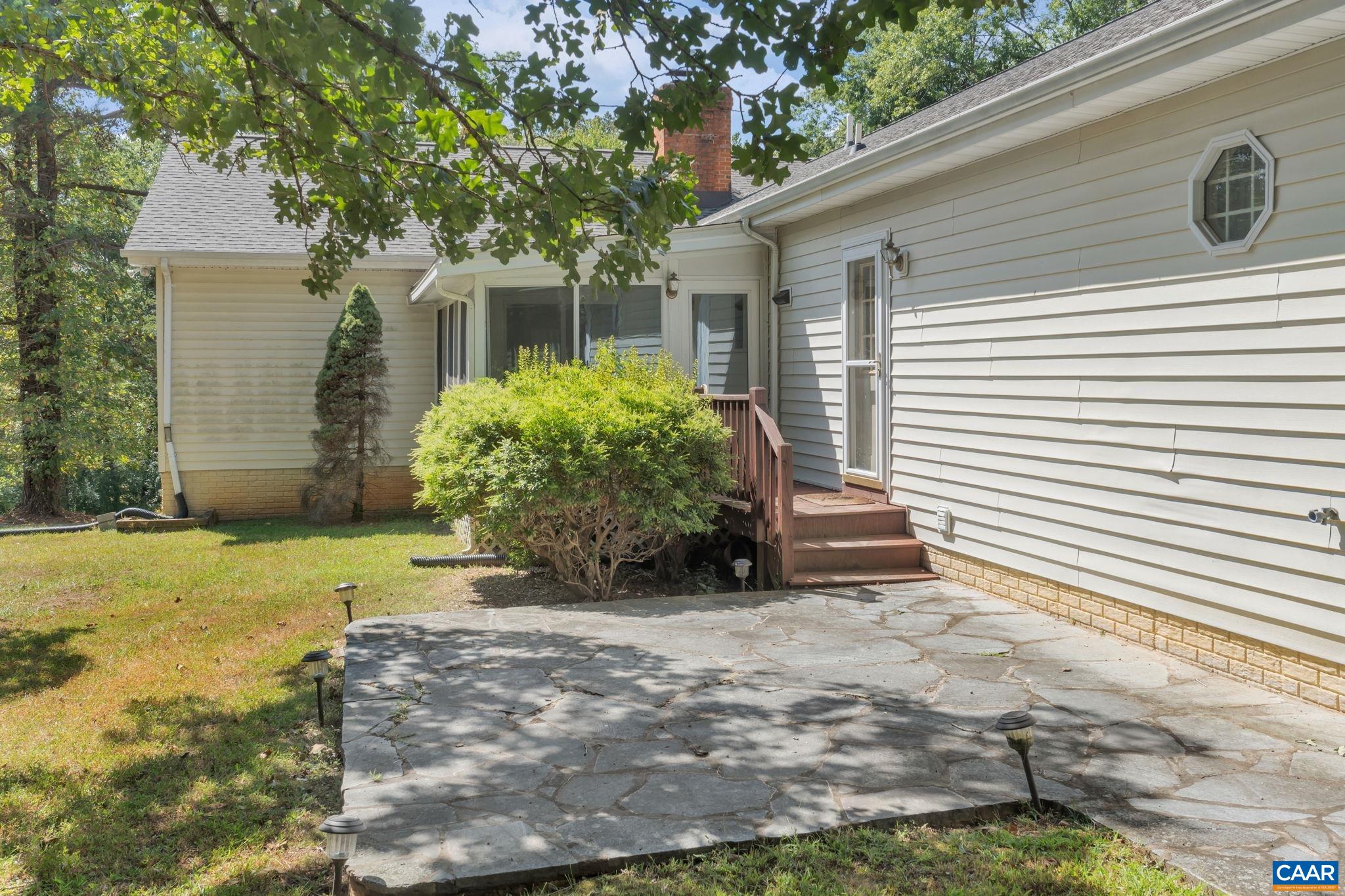 9795 Critzer Shop Road Afton, VA 22920 - Photo 19 of 22 a view of a house with backyard and a tree