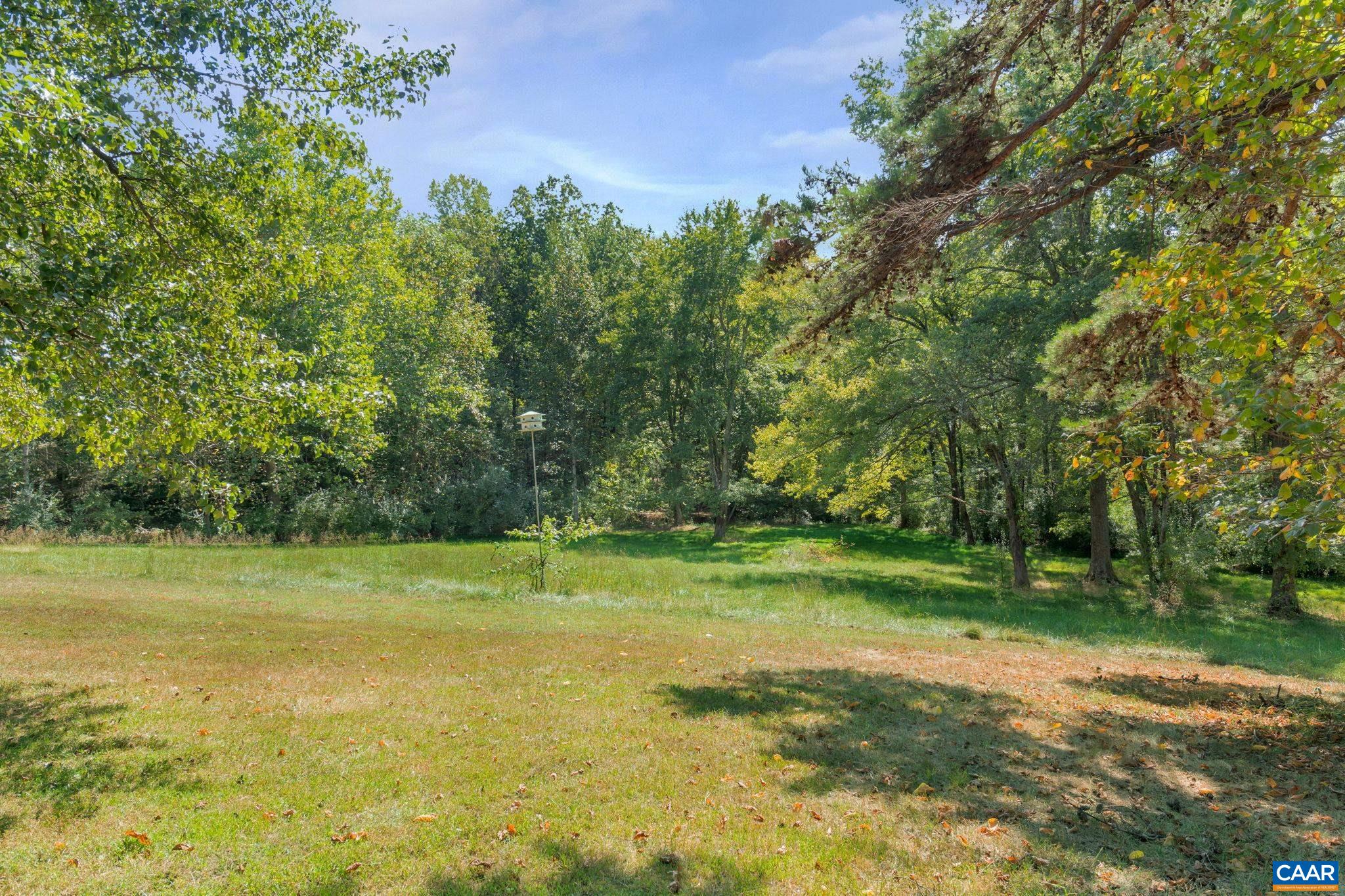 9795 Critzer Shop Road Afton, VA 22920 - Photo 2 of 22 a view of a golf course with a lake