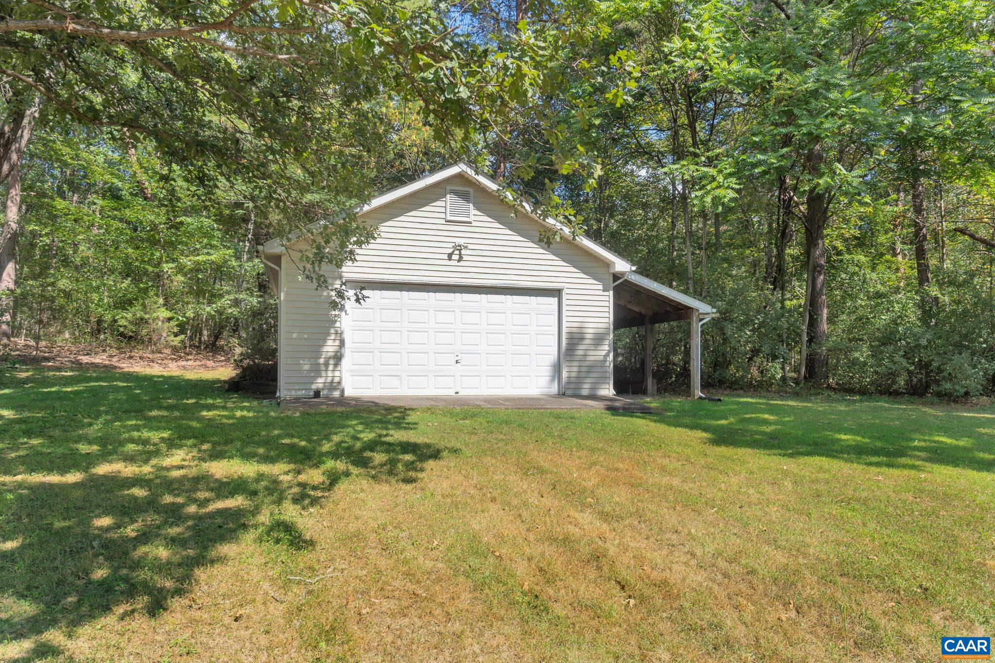 9795 Critzer Shop Road Afton, VA 22920 - Photo 21 of 22 a view of a backyard with large trees