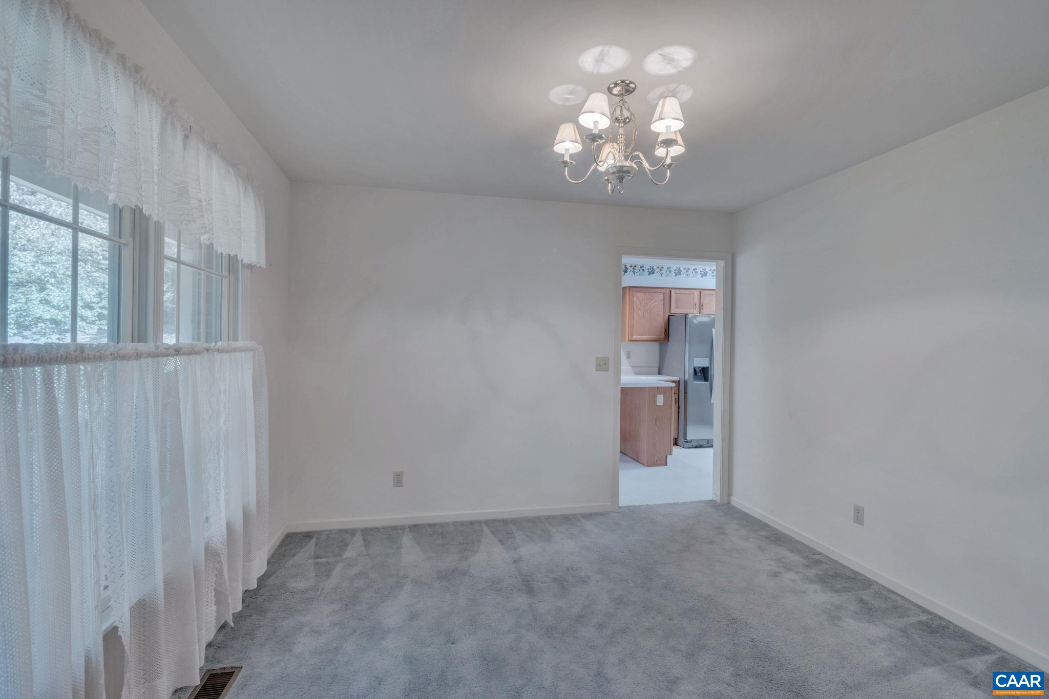 9795 Critzer Shop Road Afton, VA 22920 - Photo 5 of 22 a view of a hallway with a chandelier