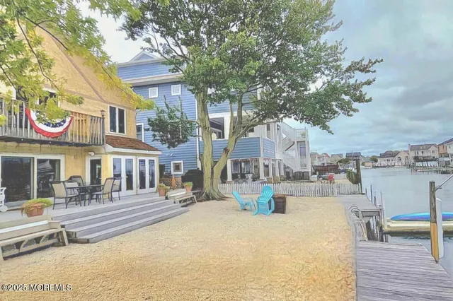 a front view of a building with sitting area