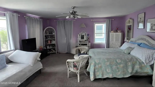 a spacious bedroom with a bed and a couch