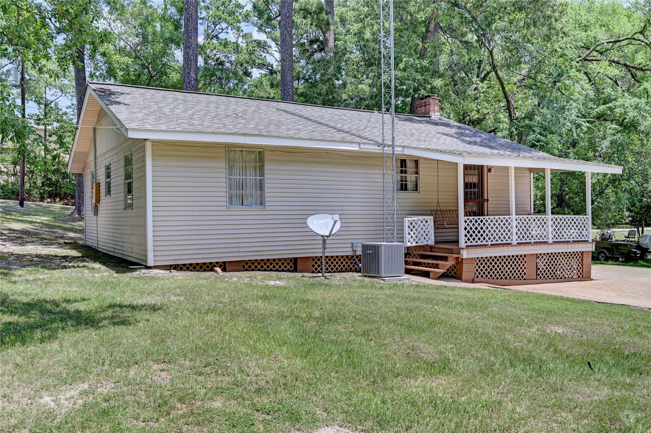 6 Hickory Hollow Road Huntsville, TX 77320 - Photo 13 of 44 a view of a house with a backyard