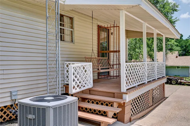 a view of a porch with two chairs