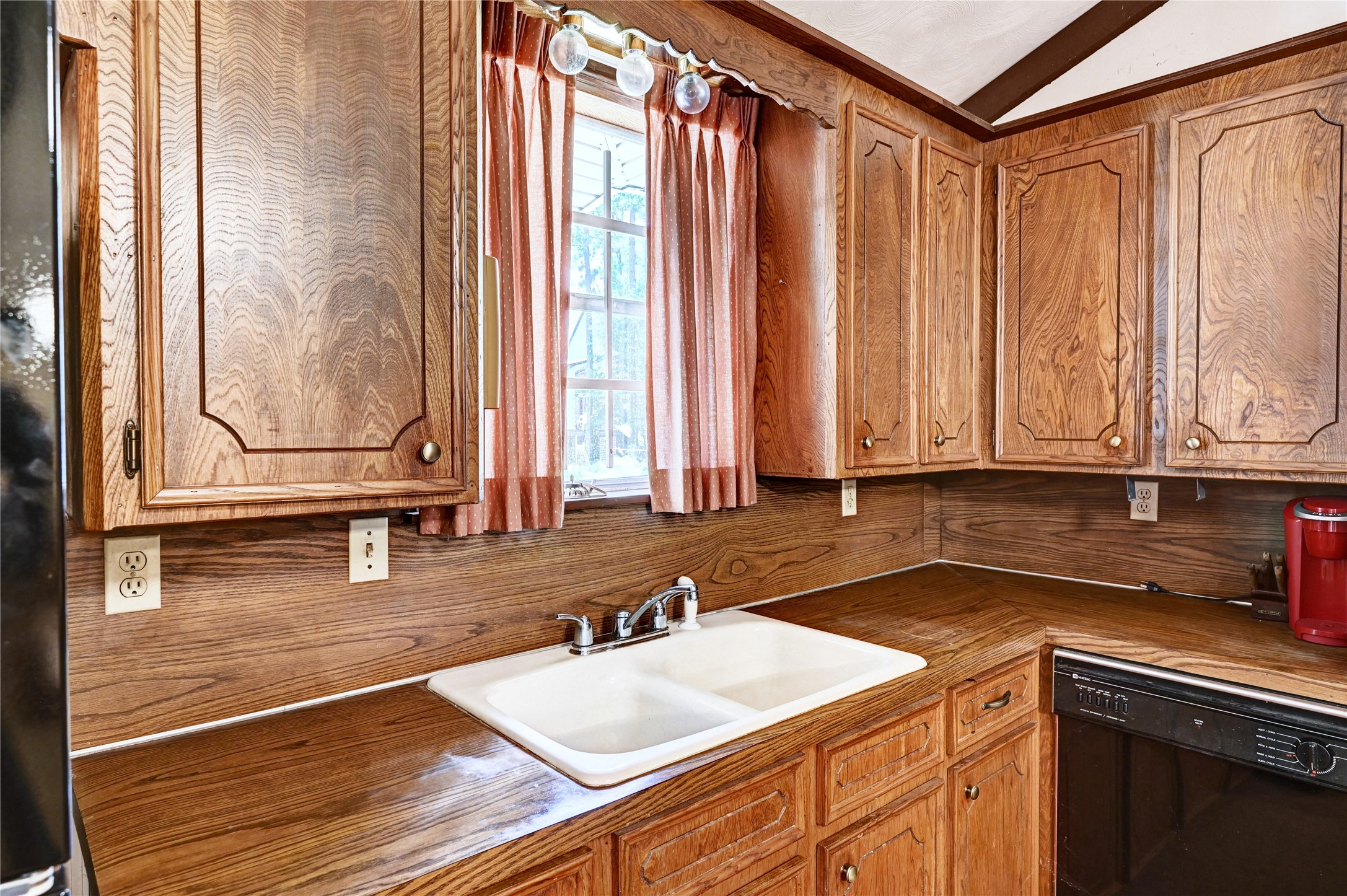 6 Hickory Hollow Road Huntsville, TX 77320 - Photo 23 of 44 a kitchen with a sink and a window