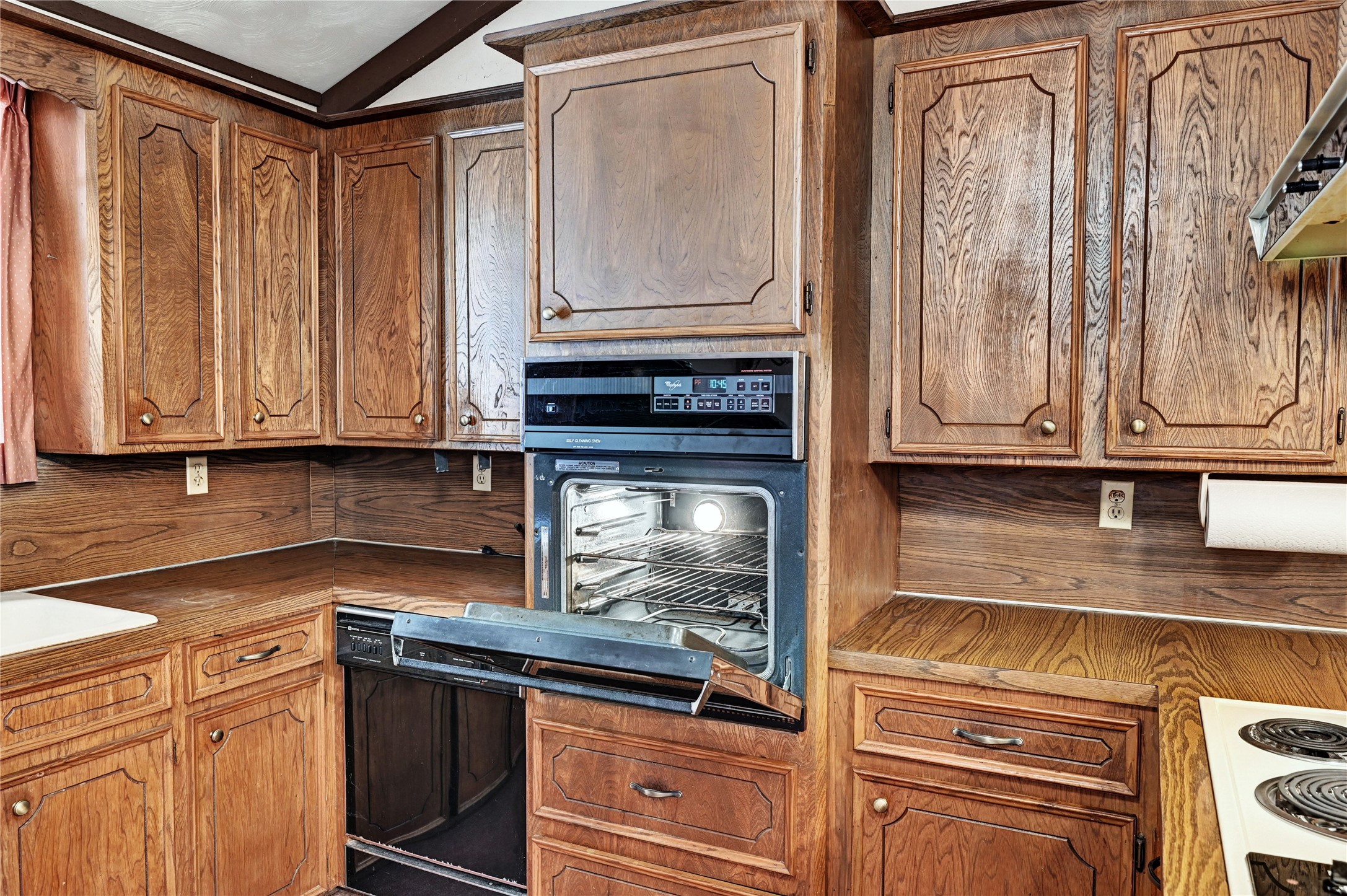 6 Hickory Hollow Road Huntsville, TX 77320 - Photo 24 of 44 a kitchen with stainless steel appliances granite countertop a refrigerator and a stove top oven