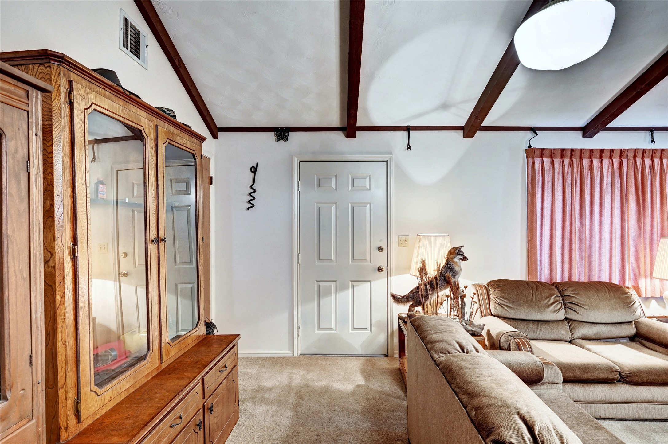 6 Hickory Hollow Road Huntsville, TX 77320 - Photo 36 of 44 a living room with furniture and a window