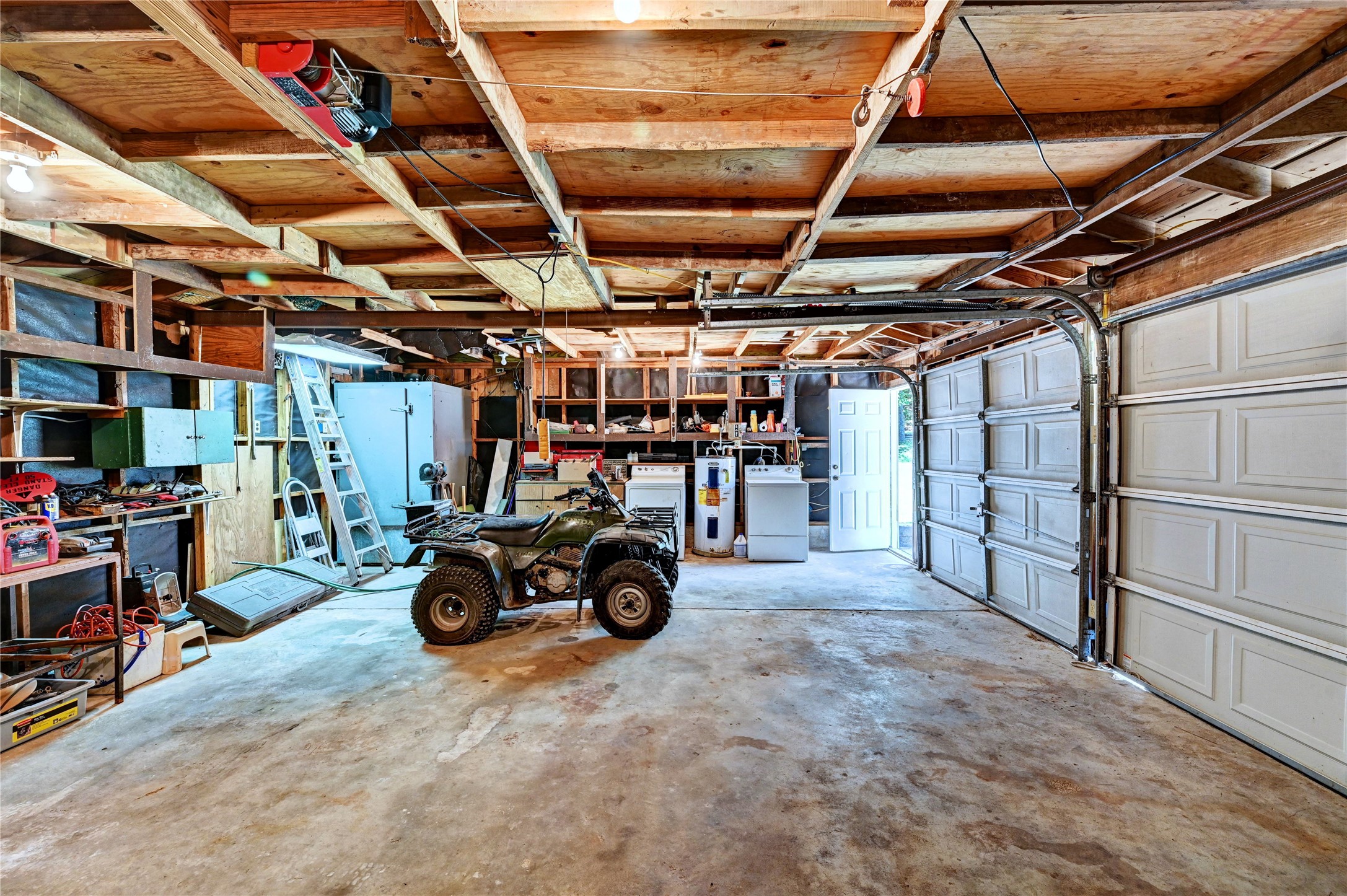 6 Hickory Hollow Road Huntsville, TX 77320 - Photo 10 of 44 a view of a garage with storage and utility