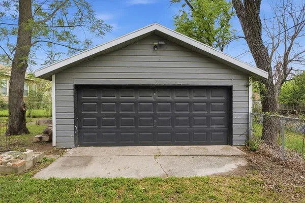 a view of balcony with wooden floor and potted plants