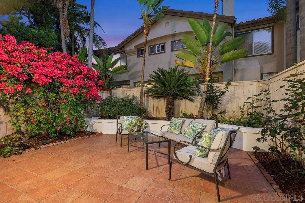 3965 Via Holgura San Diego, CA 92130 - Photo 1 of 45 a view of a backyard with plants and a patio