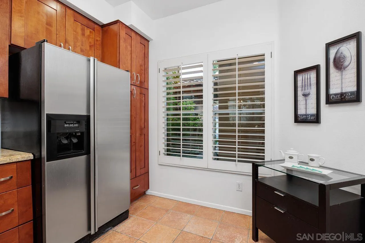 3965 Via Holgura San Diego, CA 92130 - Photo 15 of 45 a kitchen with a refrigerator a sink and dishwasher