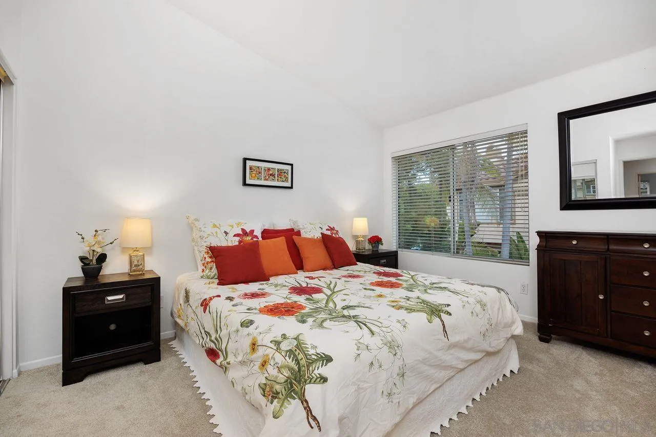 3965 Via Holgura San Diego, CA 92130 - Photo 19 of 45 a bedroom with a bed and a closet