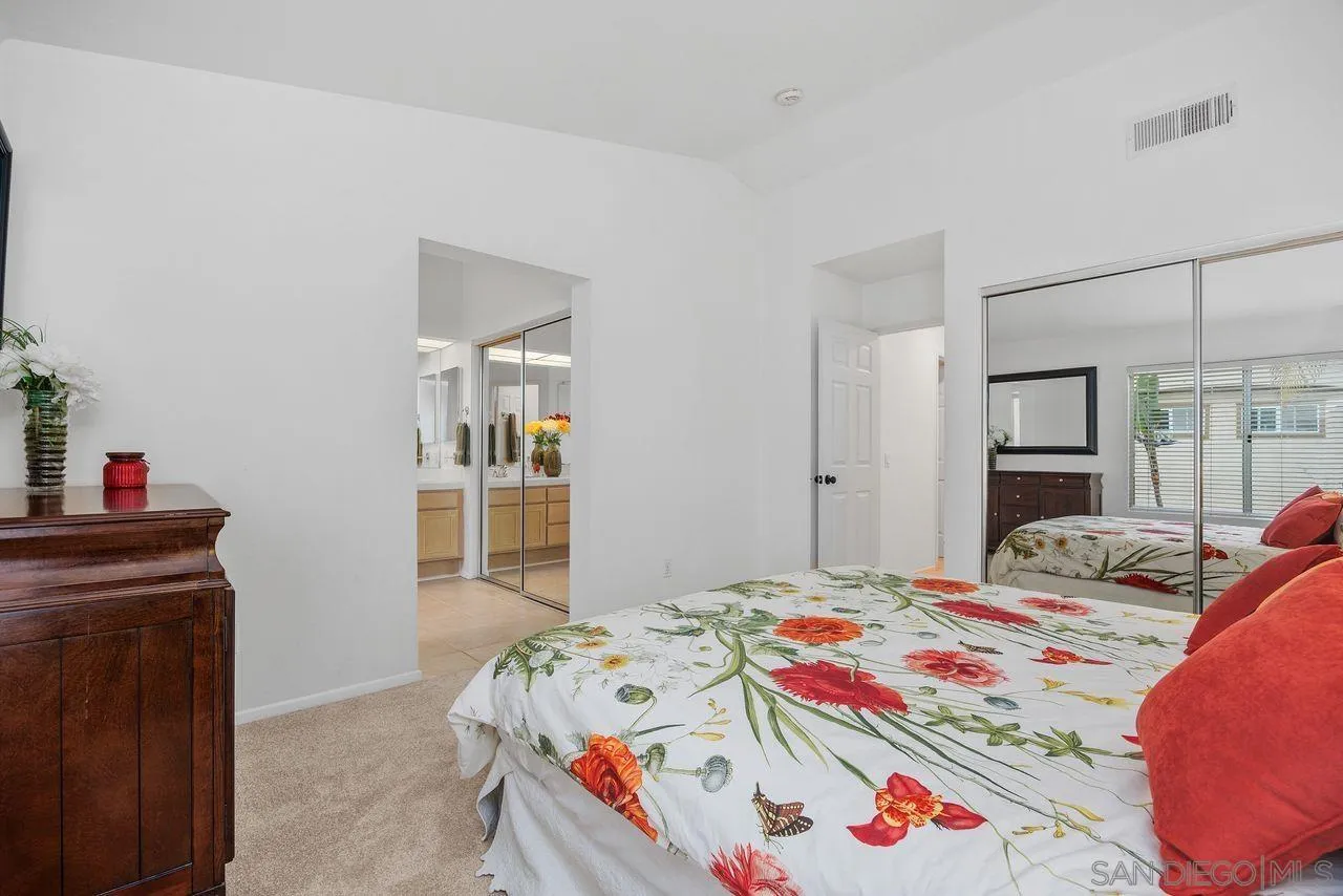 3965 Via Holgura San Diego, CA 92130 - Photo 20 of 45 a bedroom with a bed and a dresser