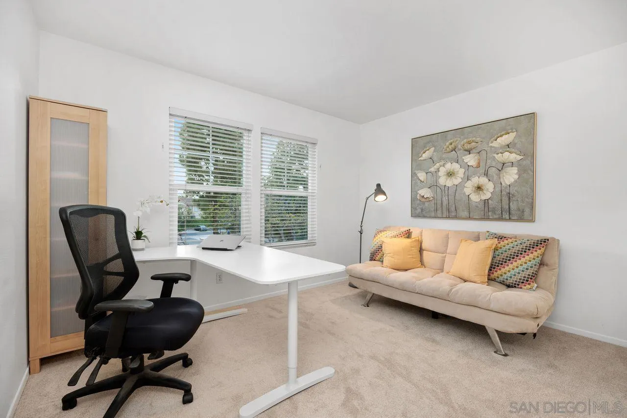 3965 Via Holgura San Diego, CA 92130 - Photo 24 of 45 a living room with furniture and a large window