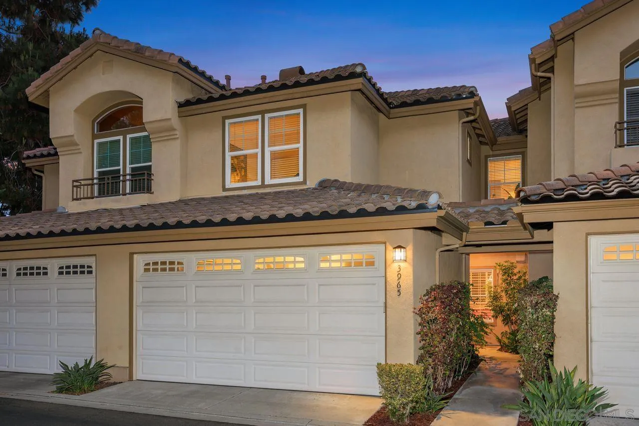 3965 Via Holgura San Diego, CA 92130 - Photo 3 of 45 a front view of a house with a garden