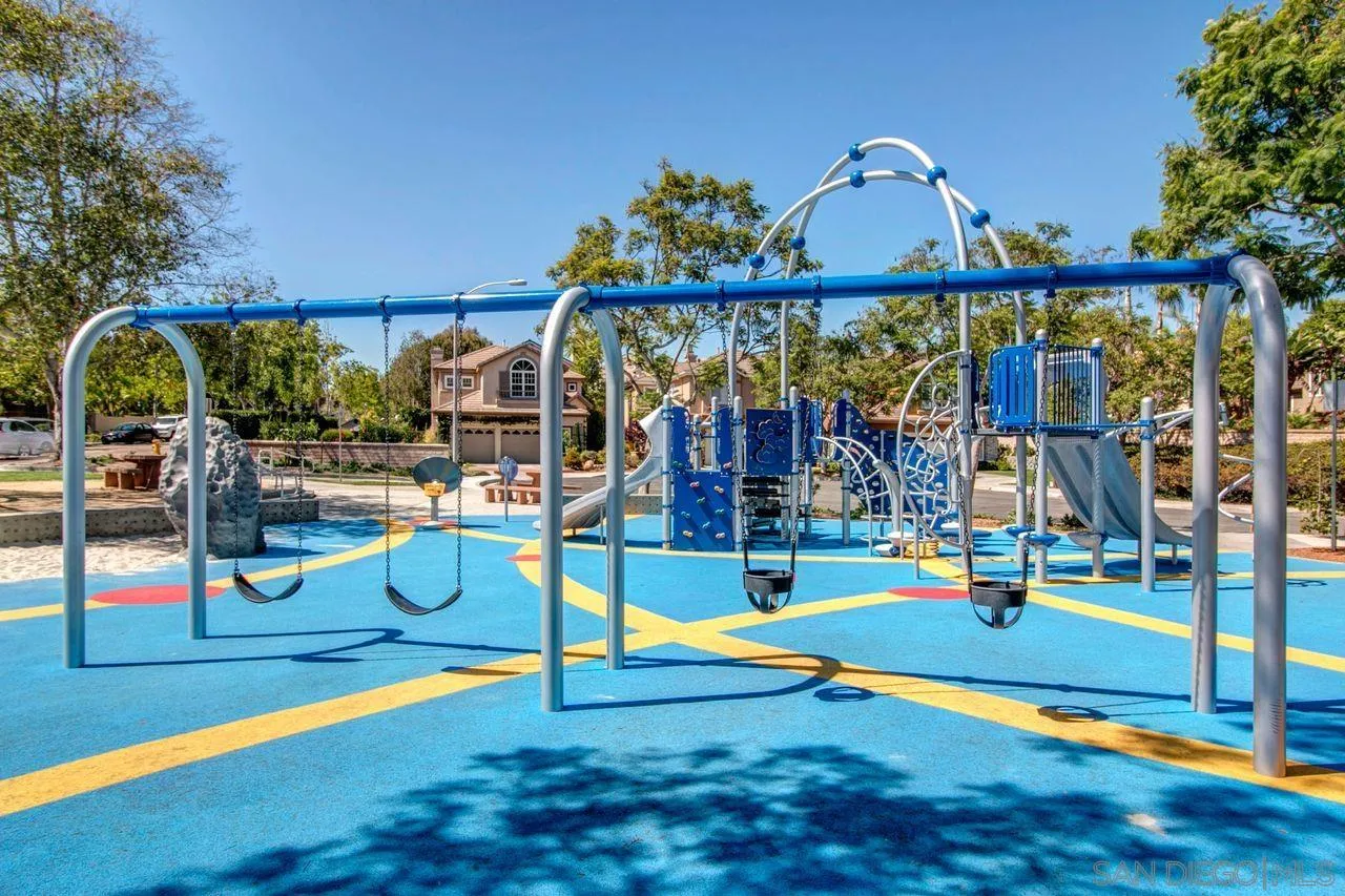 3965 Via Holgura San Diego, CA 92130 - Photo 36 of 45 a view of a park with swings