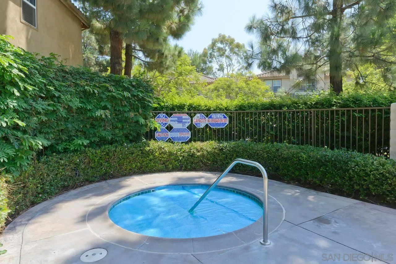 3965 Via Holgura San Diego, CA 92130 - Photo 38 of 45 a backyard of a house with lots of green space