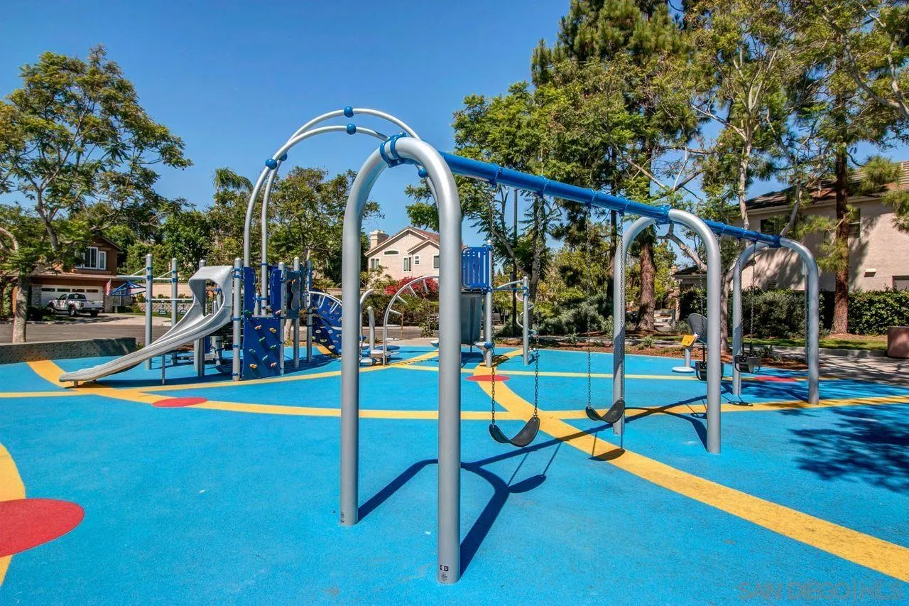 3965 Via Holgura San Diego, CA 92130 - Photo 39 of 45 a view of swimming pool with lawn chairs and plants