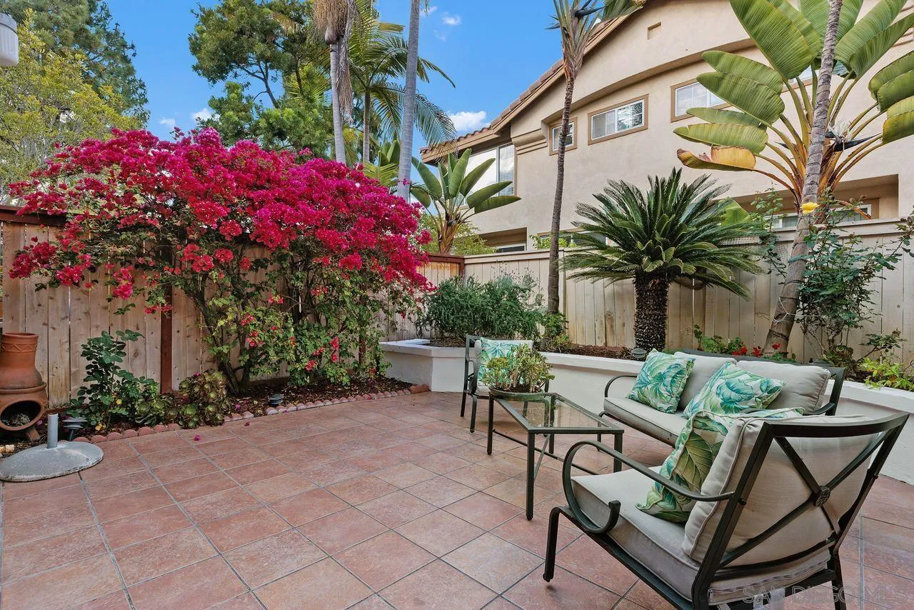 3965 Via Holgura San Diego, CA 92130 - Photo 6 of 45 a backyard of a house with table and chairs